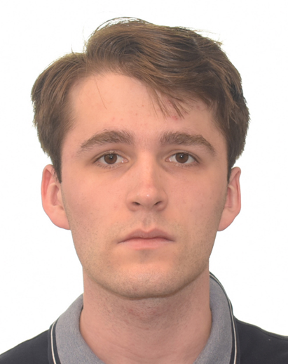 A photo of Nikolas. He is a young white man and looks serious.